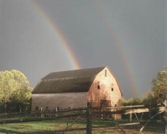 Rainbow over a barn